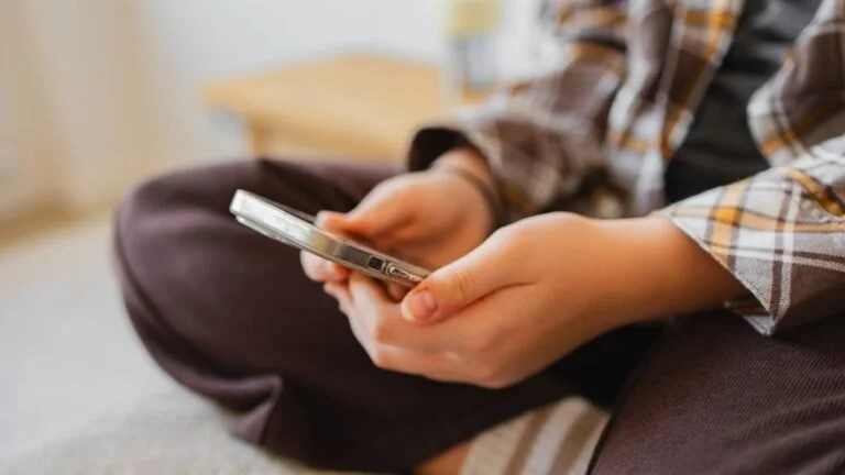 Person on their phone on social media